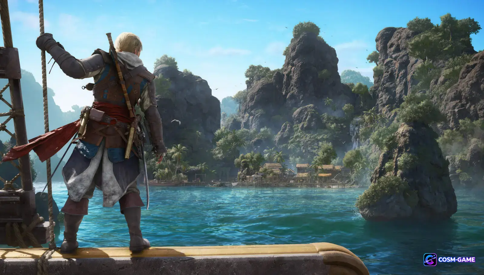 Edward Kenway stands aboard the Jackdaw while facing a rocky tropical island across clear Caribbean water.