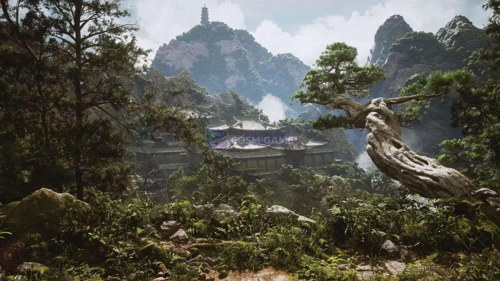A temple complex sits among lush mountain peaks with a twisted pine tree in the foreground.