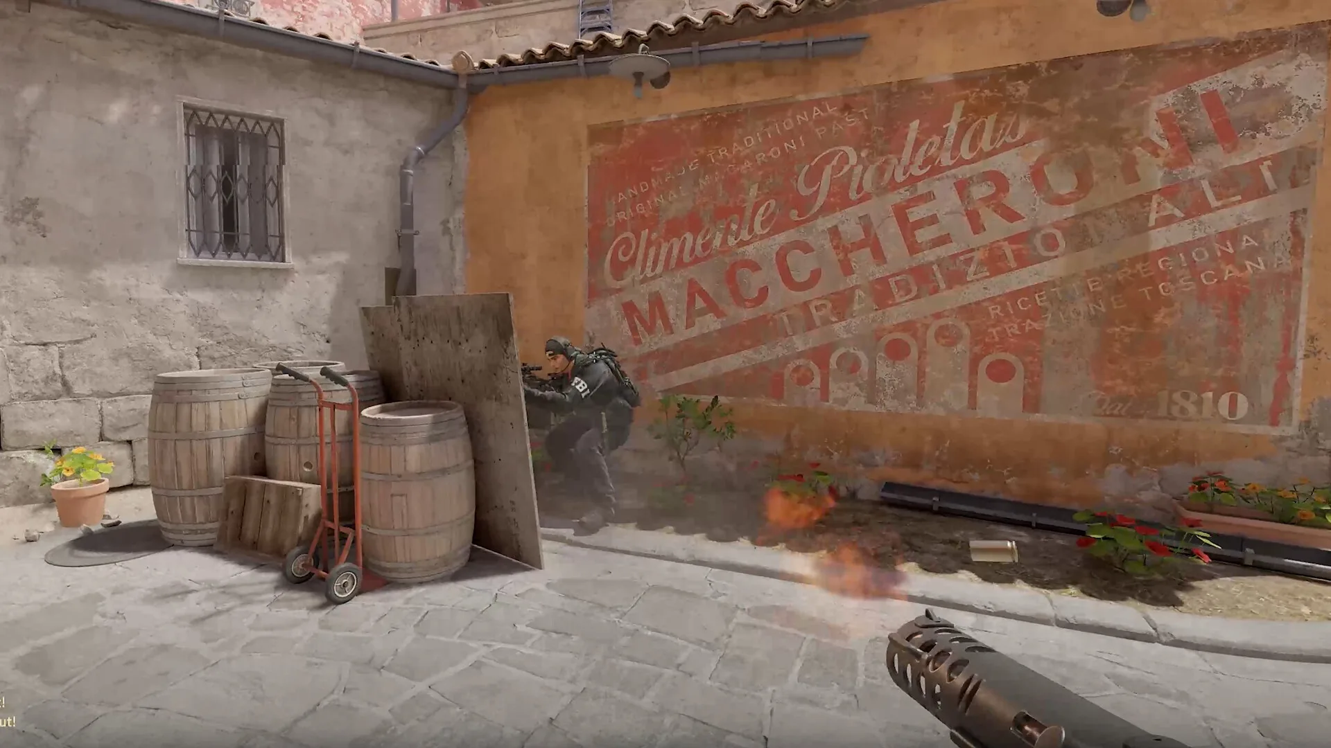 A player aiming a rifle during a Counter-Strike 2 firefight.