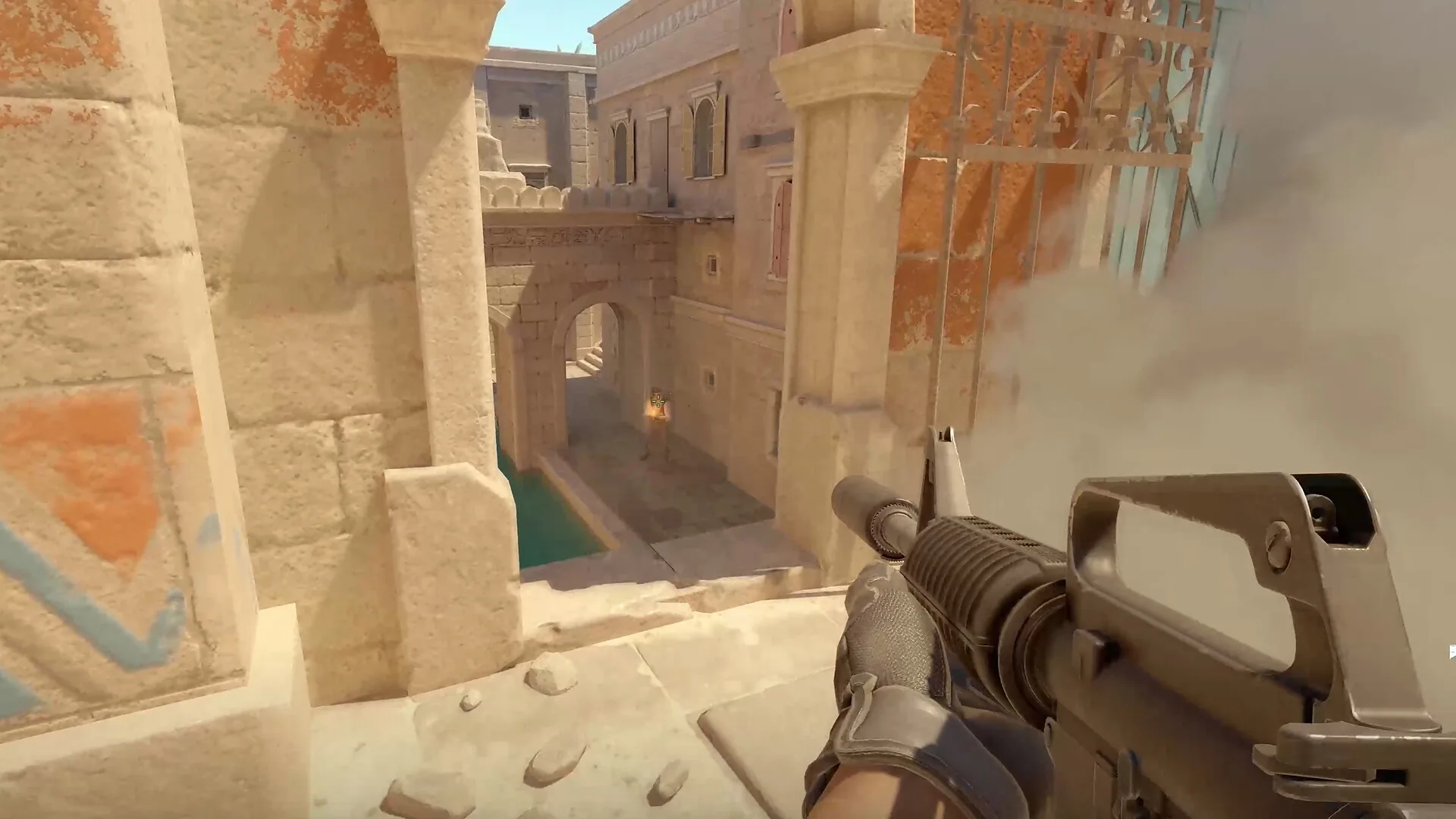A smoke grenade cloud changing the sightline during a Counter-Strike 2 round.