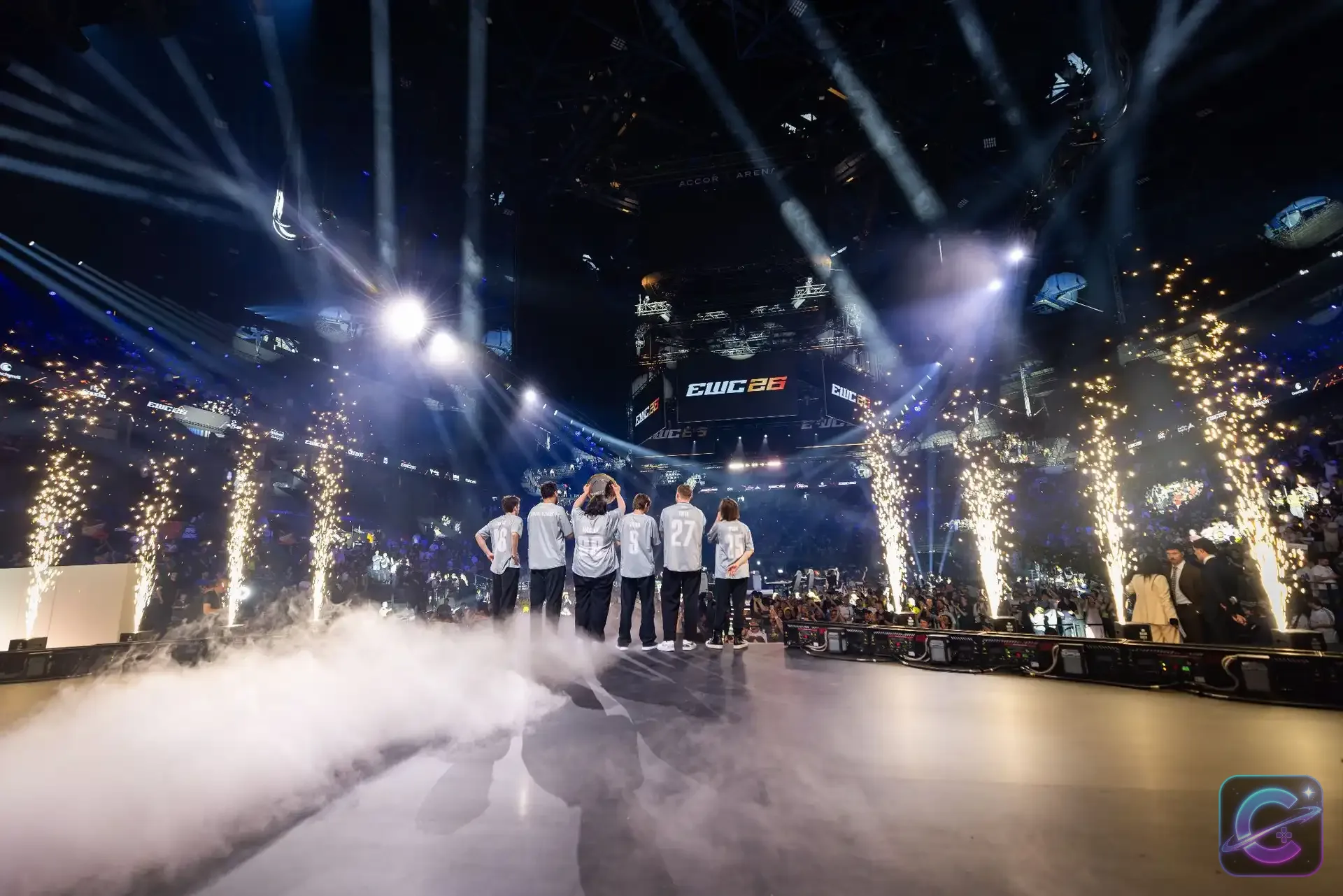 Team Spirit stands on the EWC 2026 stage at Accor Arena with pyrotechnics around the team.