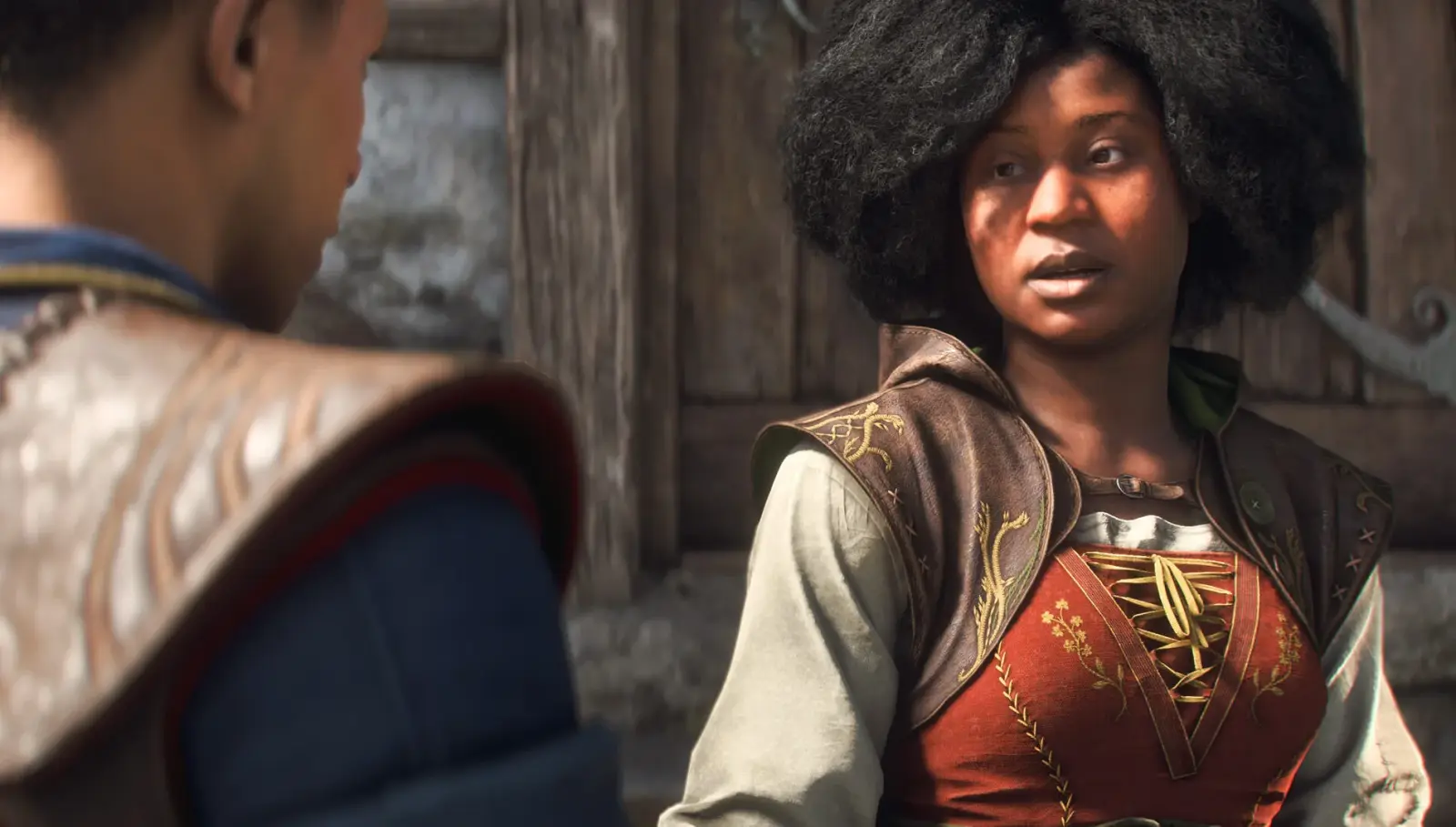 Arden speaks with the Hero outside a timber building in Albion.