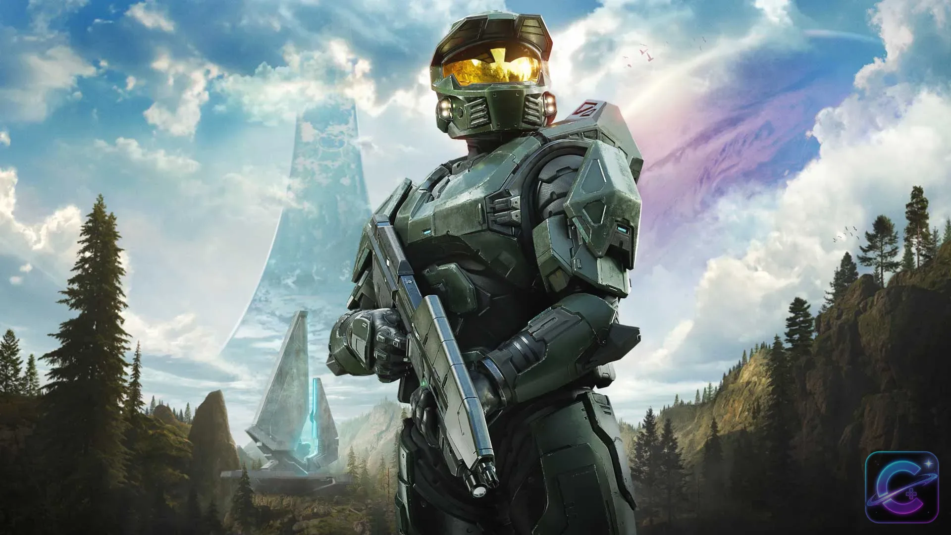 Master Chief stands with an assault rifle before a forested valley while the Halo ring curves across the sky.