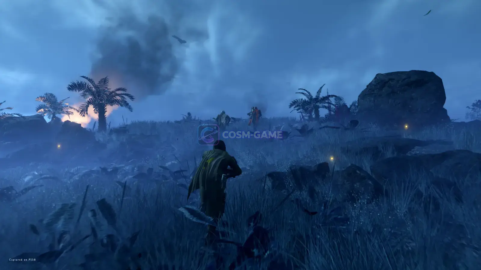 Helldivers move through a blue-lit alien environment during a mission.