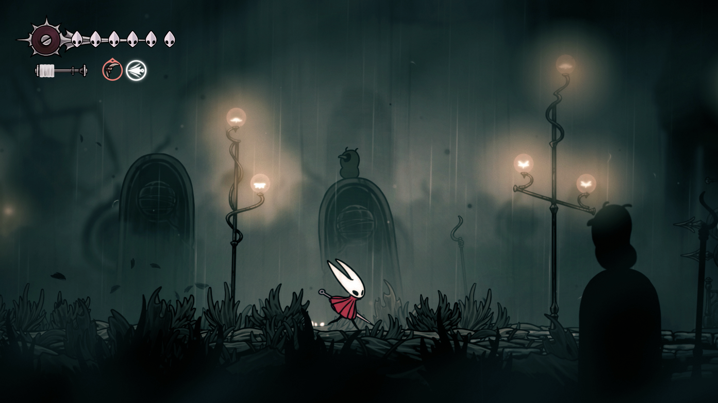 Hornet walks through the dark misty streets of Greymoor beneath glowing lamps.