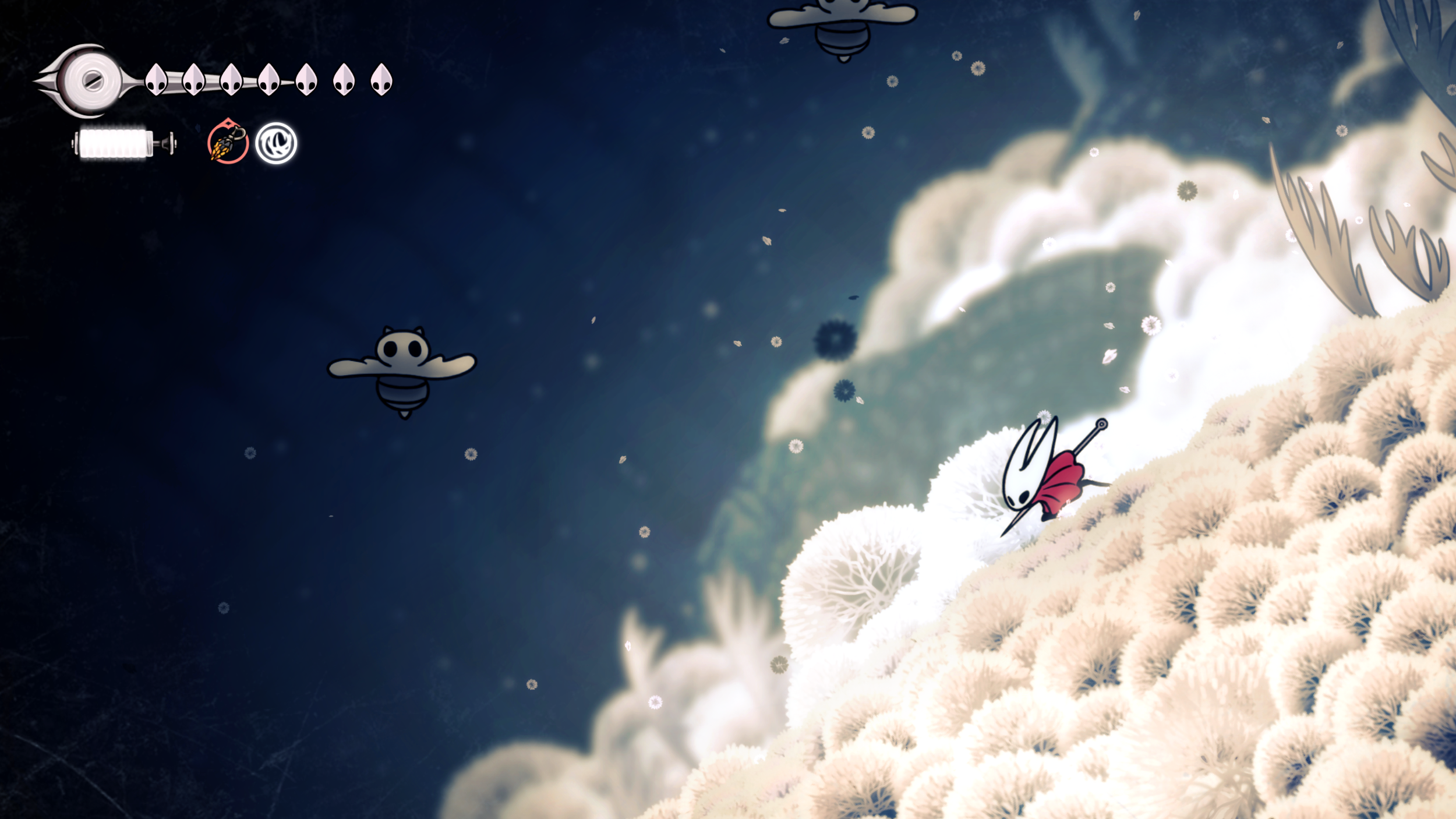 Hornet climbs across pale vegetation high above a dark landscape while flying creatures approach.