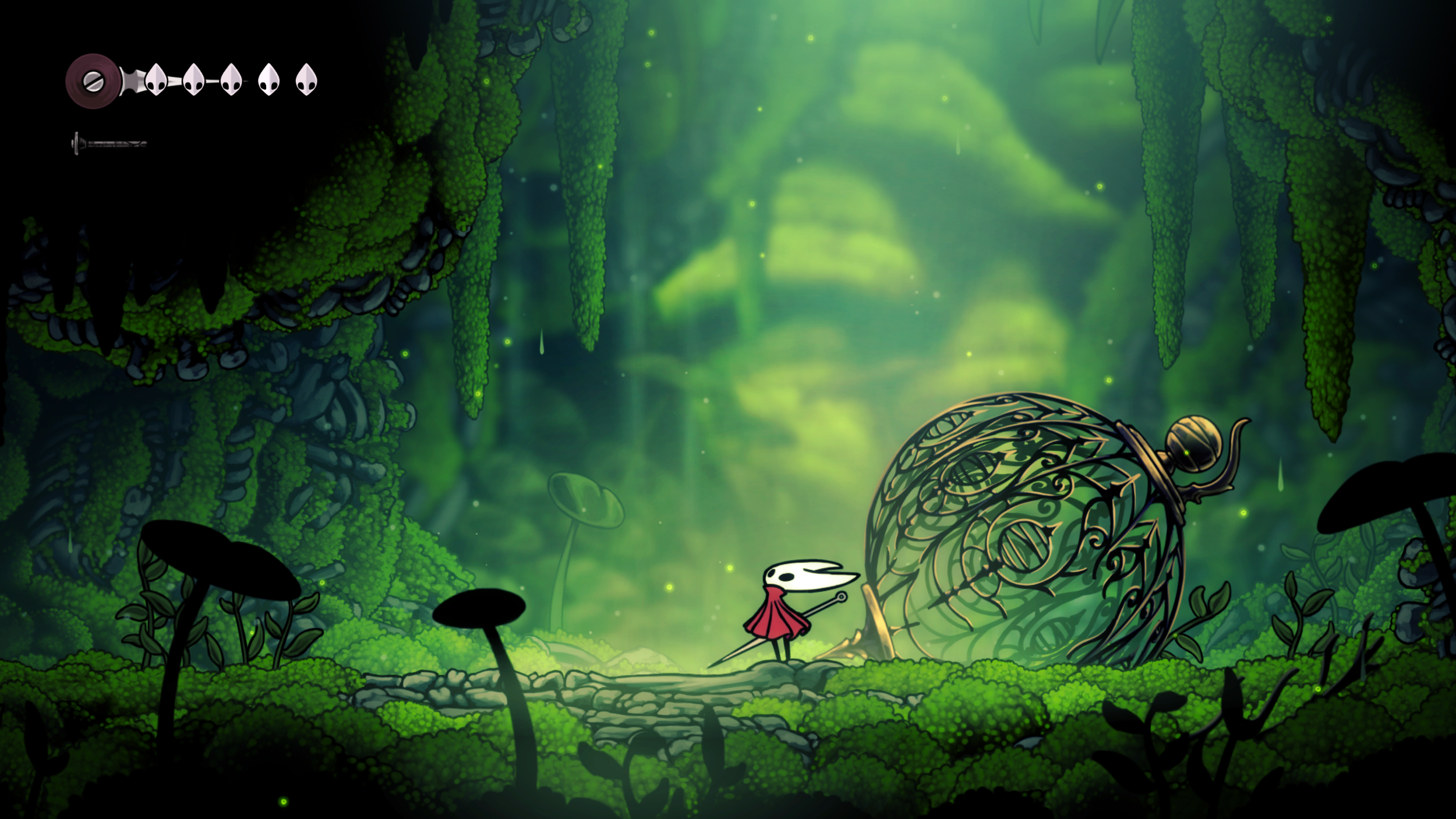 Hornet stands in a luminous green grotto beside an ornate spherical structure.