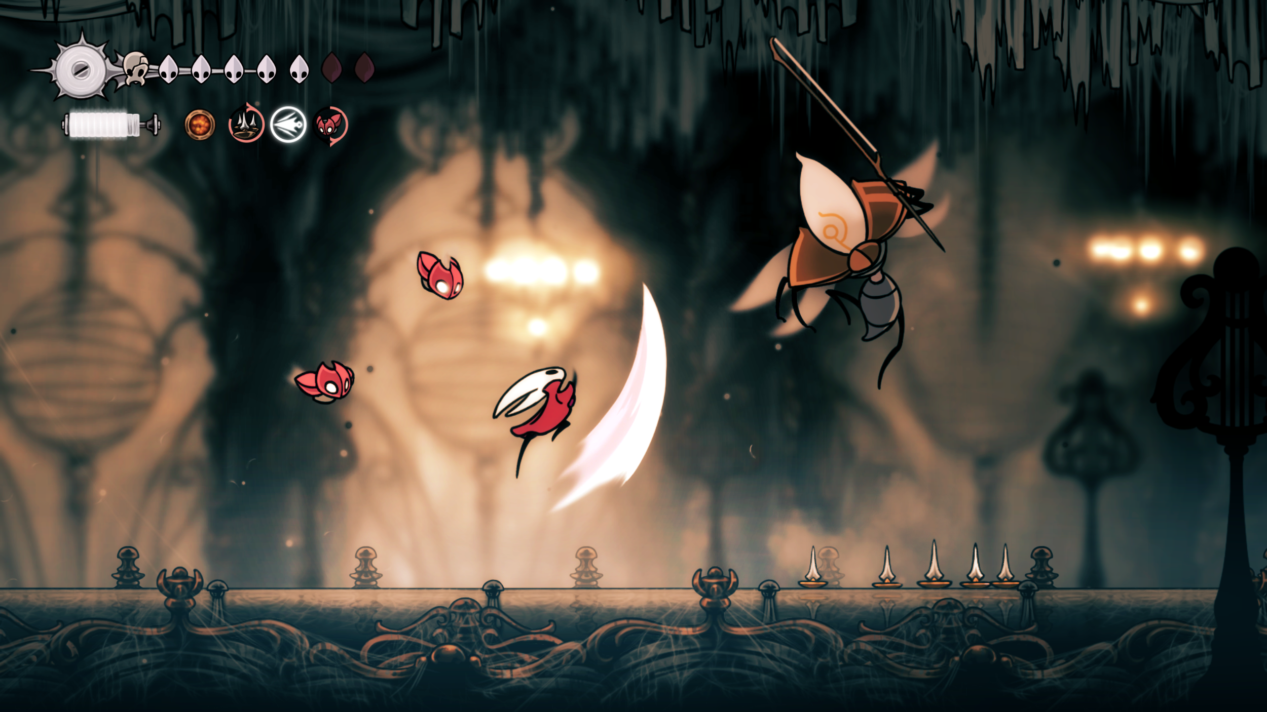 Hornet moves through an ornate interior chamber within Pharloom.