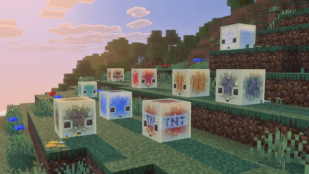 Minecraft sulfur cubes containing different absorbed blocks on a grassy hillside