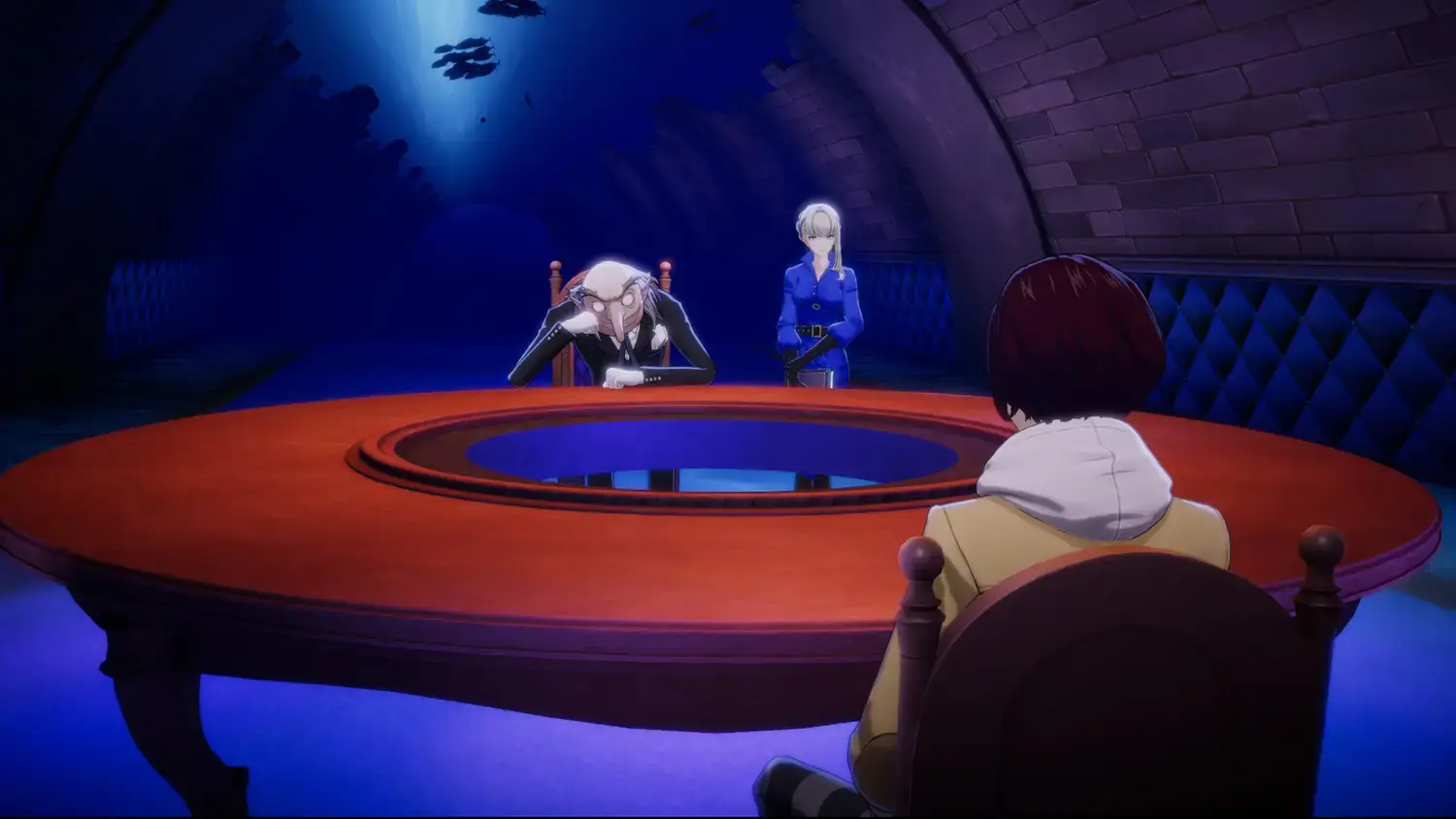 The protagonist seated across from Igor and Merope inside the blue-lit Velvet Room
