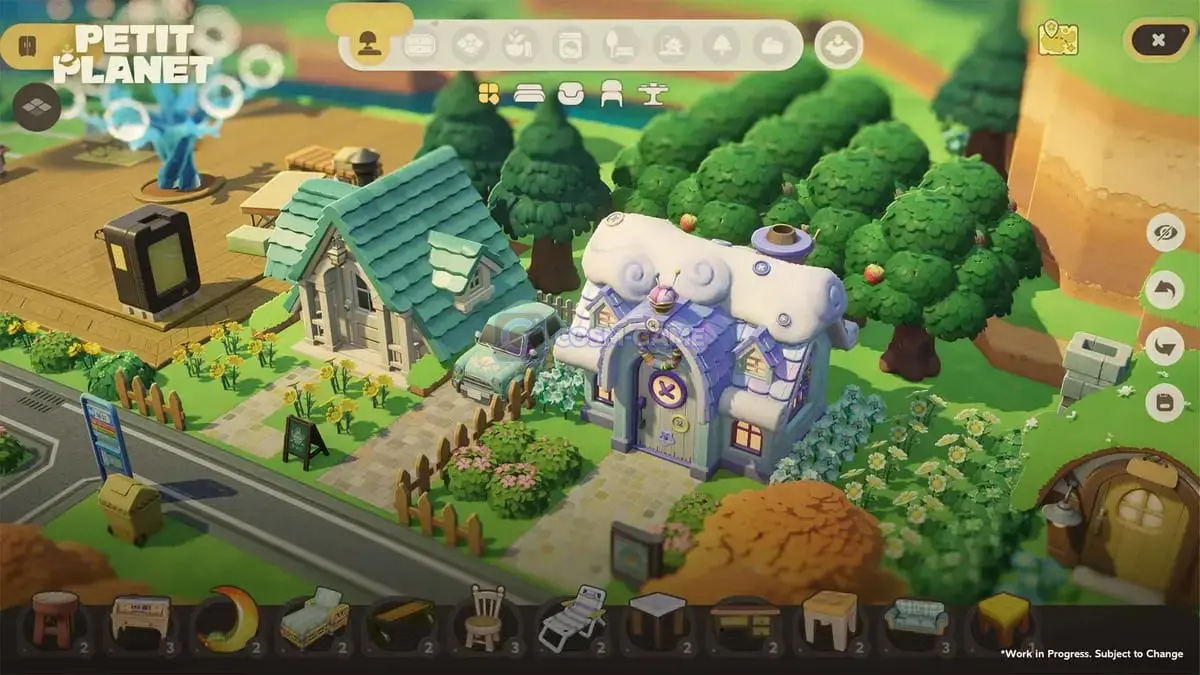 Overhead view of a small planet town with colorful houses, trees, roads, and outdoor furniture arranged on green terrain.