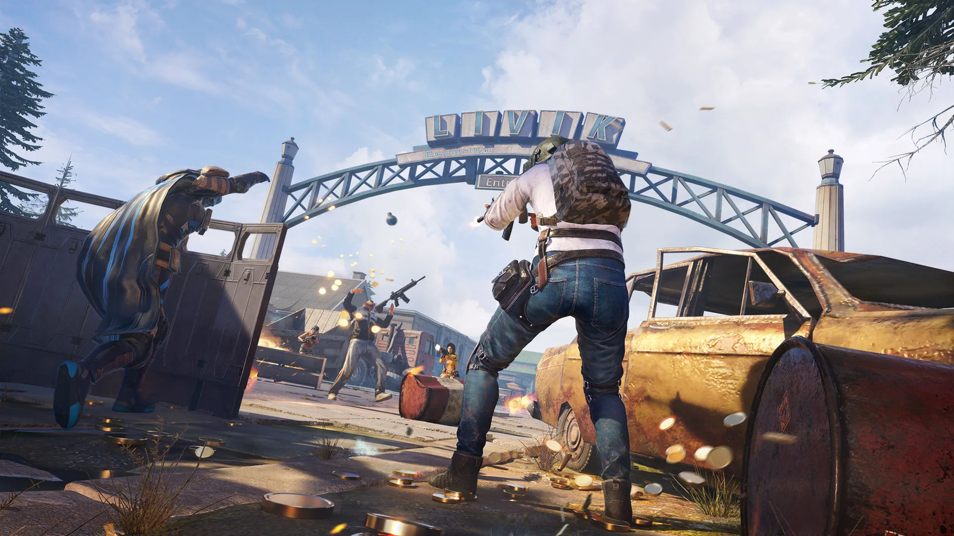 Several armed players exchange fire around vehicles and cover at the entrance to an industrial area.