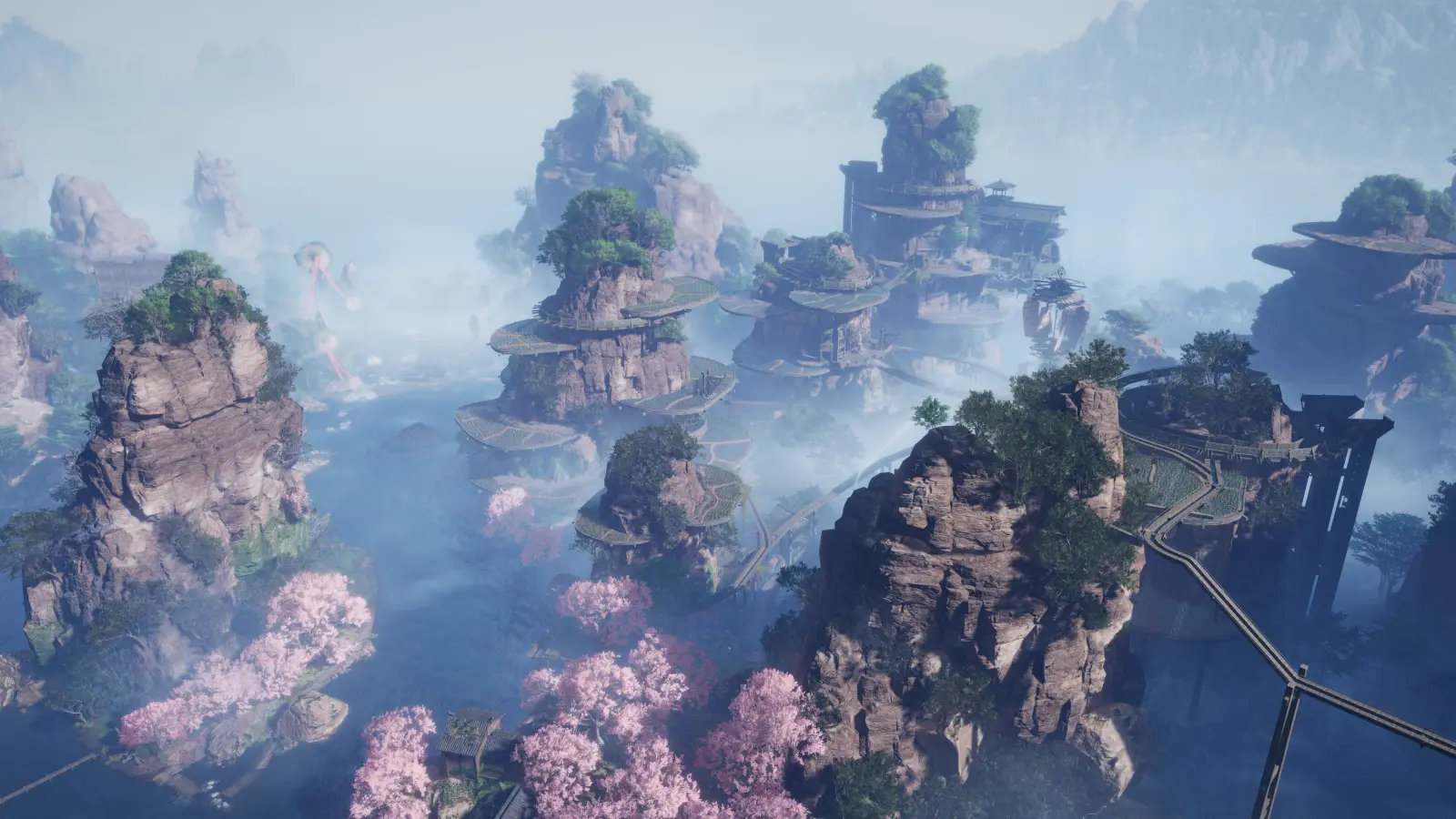 A vast mountain landscape of towering rock pillars, winding elevated paths, mist, and clusters of pink-blossomed trees.