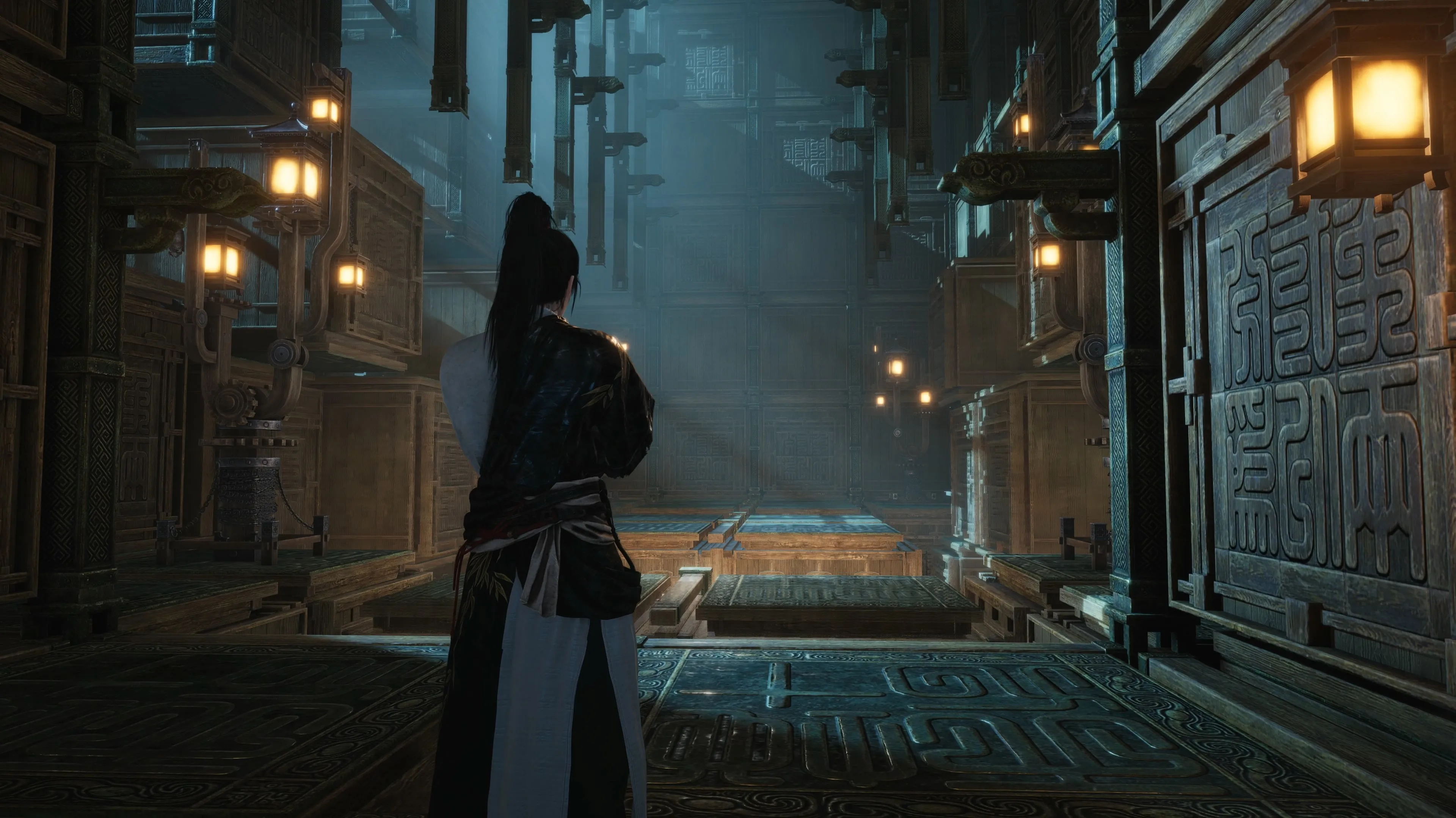 Large mechanical structures stand among the cliffs and buildings of Hidden Mountain.